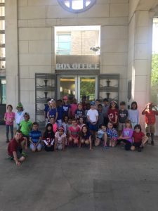 Students in front of the doors at the Muny