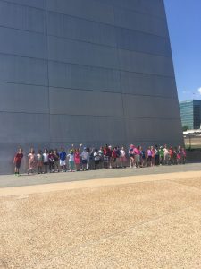 Students at the base of the arch